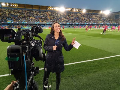 Semra smiling for the camera at the Vicente Calderón stadium ahead of an Atlético de Madrid Champions League game